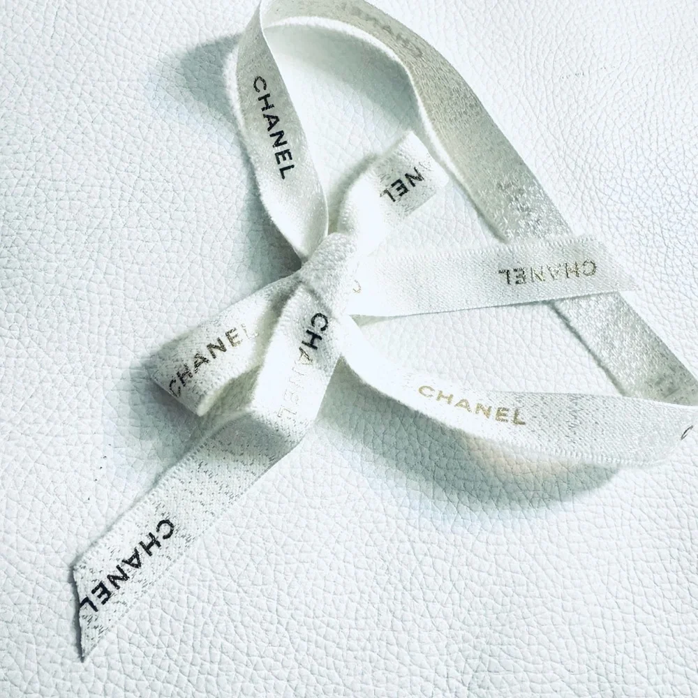 Chanel White Ribbon w gold font limited edition for holiday
